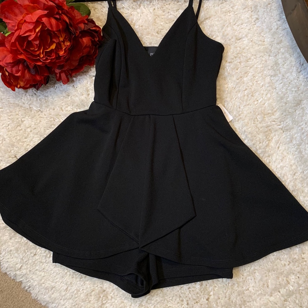 Black spaghetti strapped romper skirt.